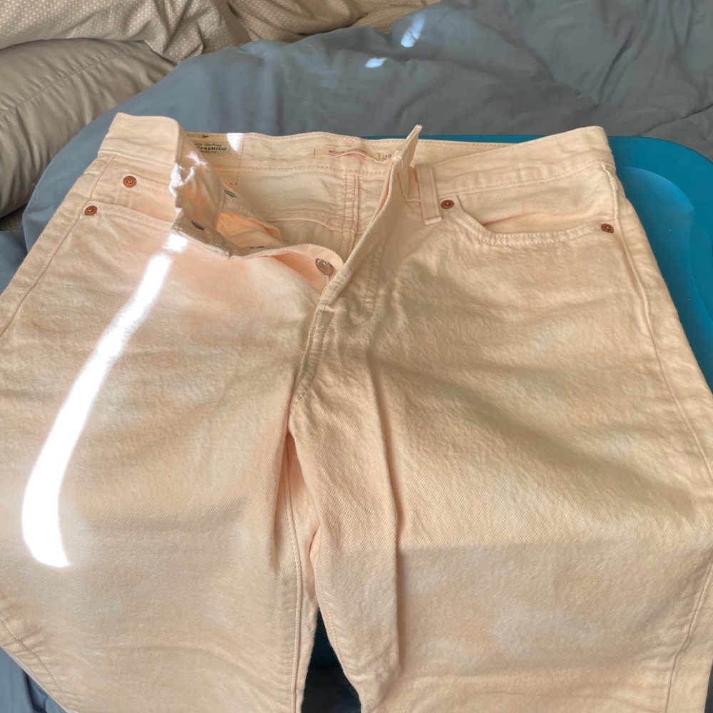 Levi’s size 29 with a button fly. NEVER WORN.